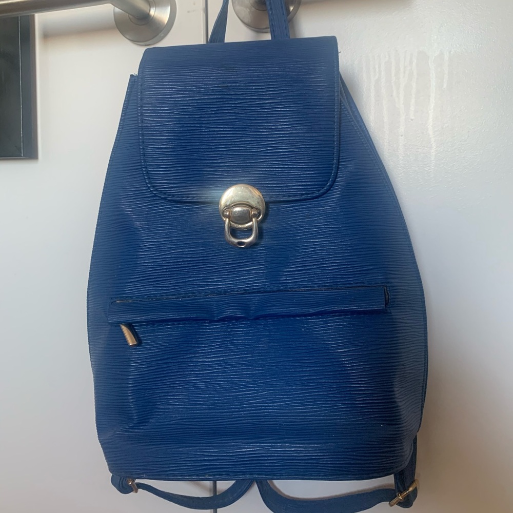 Vintage blue leather and gold backpack